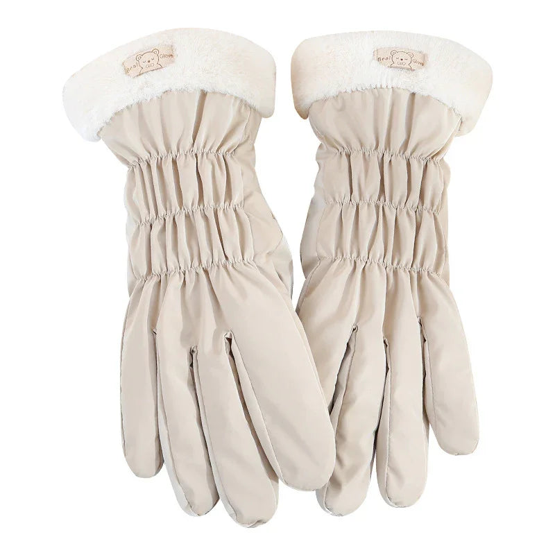 Pair of beige winter gloves with elastic wrist and white fleece cuffs featuring bear logo