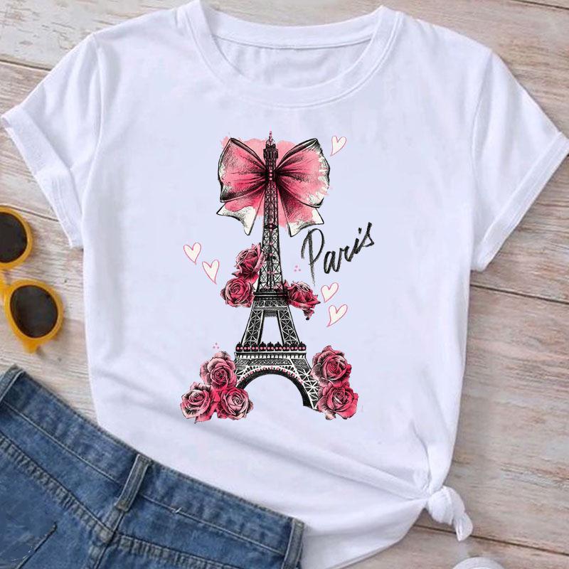 White t-shirt with Eiffel Tower graphic decorated with pink roses, bow, and handwritten Paris text