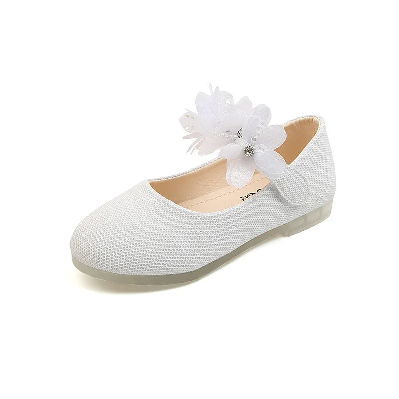 White textured girls' Mary Jane shoe with floral embellishment and rhinestone details