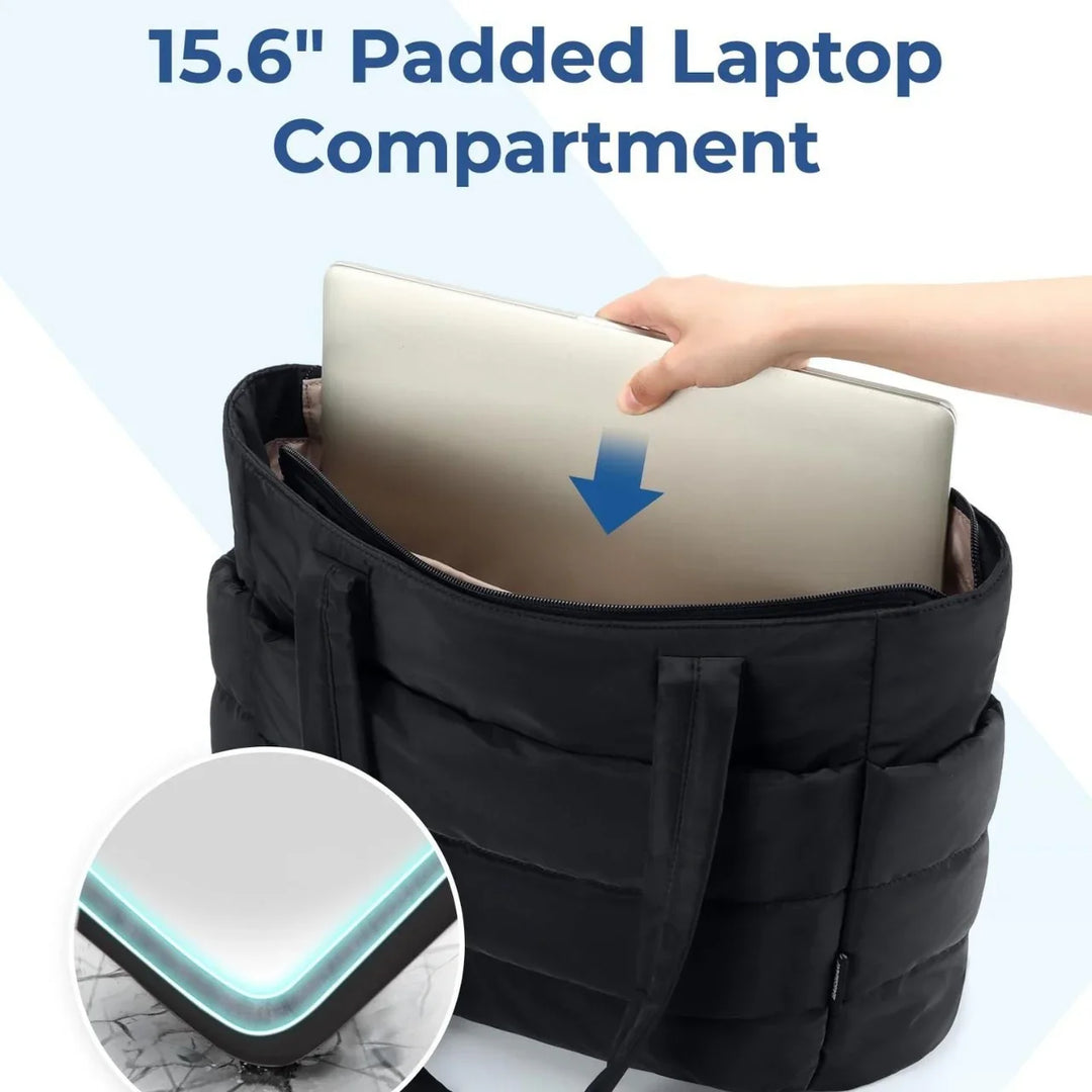 Black padded tote bag with 15.6 inch laptop compartment and hand inserting laptop
