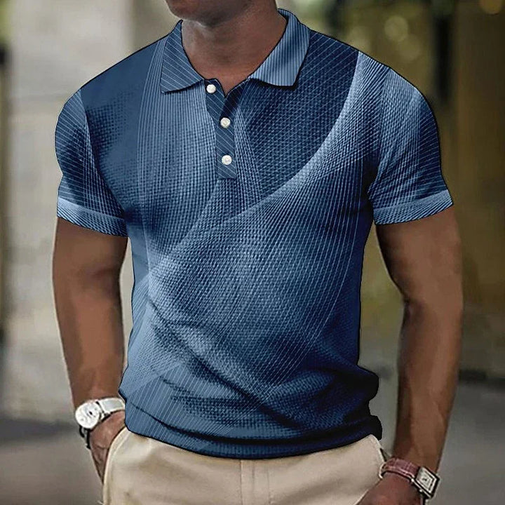 Man wearing blue patterned short-sleeve polo shirt with beige pants and wristwatches