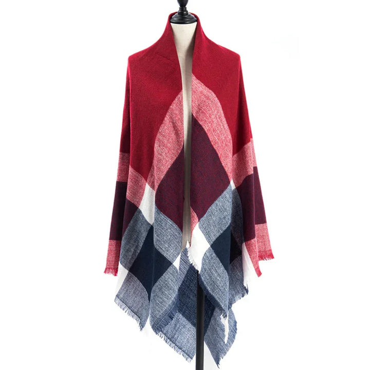 red, pink, white, and blue plaid blanket scarf draped on mannequin