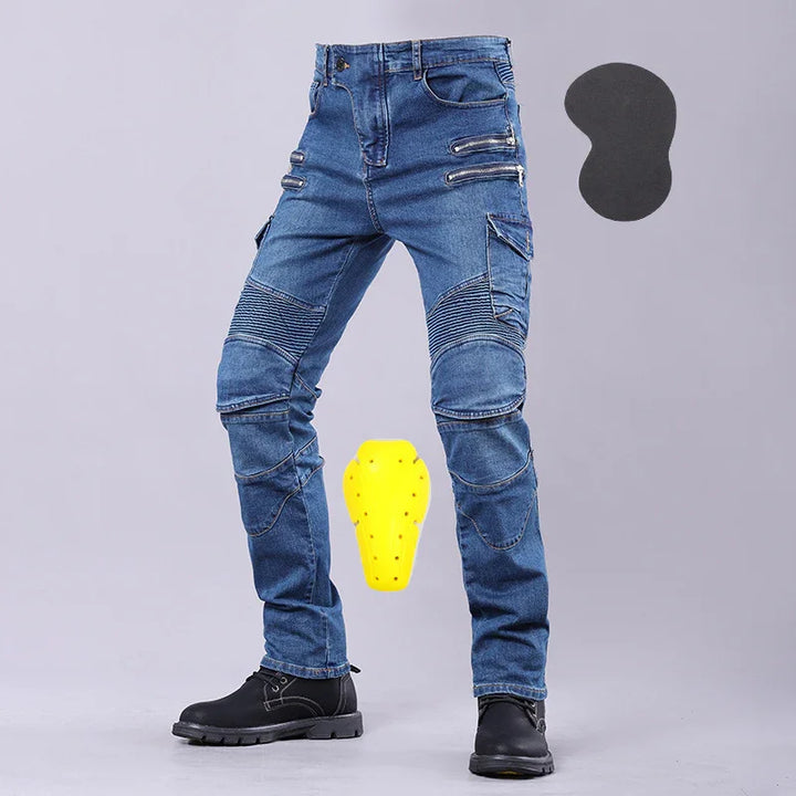 Men's blue motorcycle riding jeans with knee armor and black boots on gray background