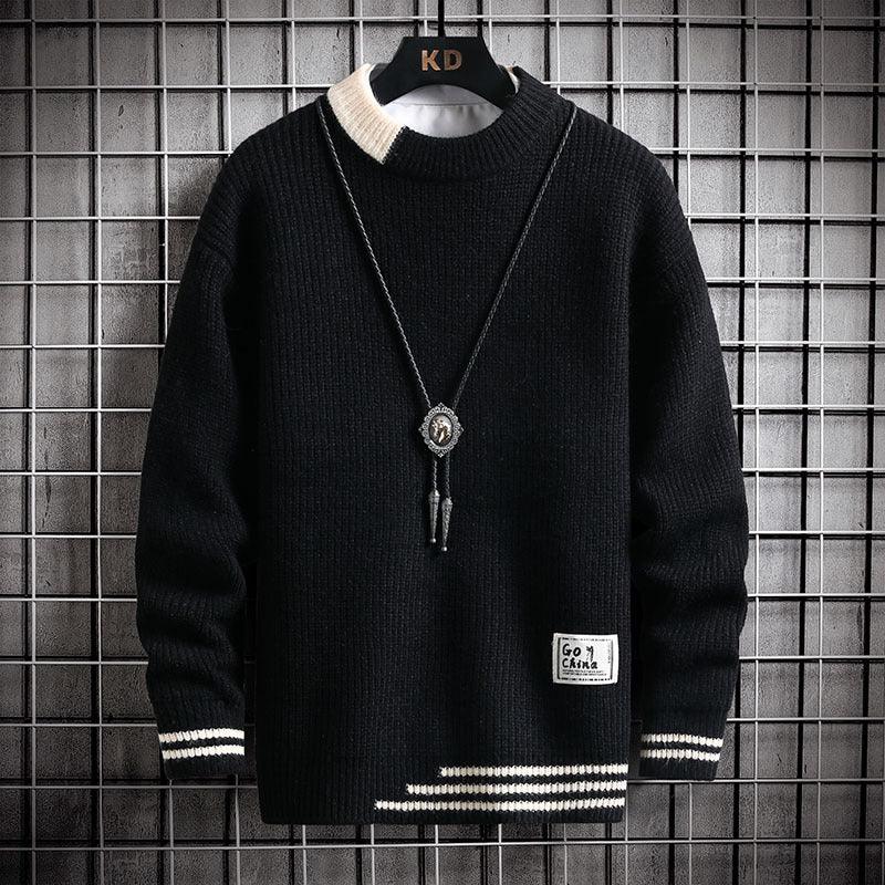 Black knit sweater with white striped accents on collar, cuffs, and hem, displayed on KD hanger