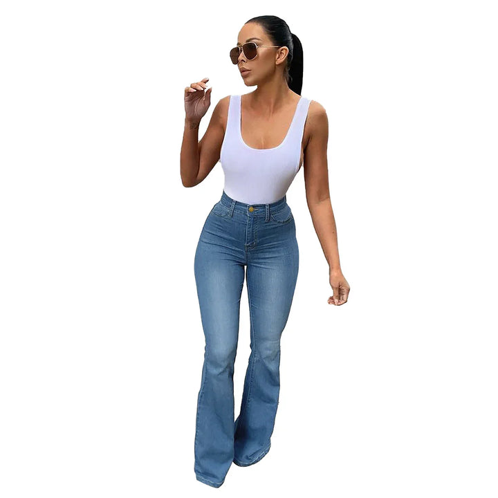Woman wearing white tank top and high-waisted flared blue jeans with sunglasses