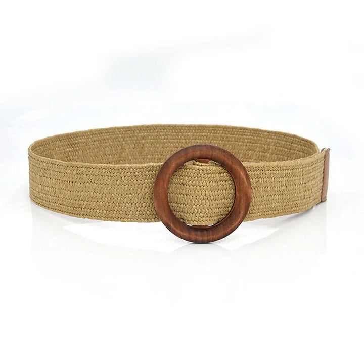 Natural woven beige belt with round wooden buckle on white background