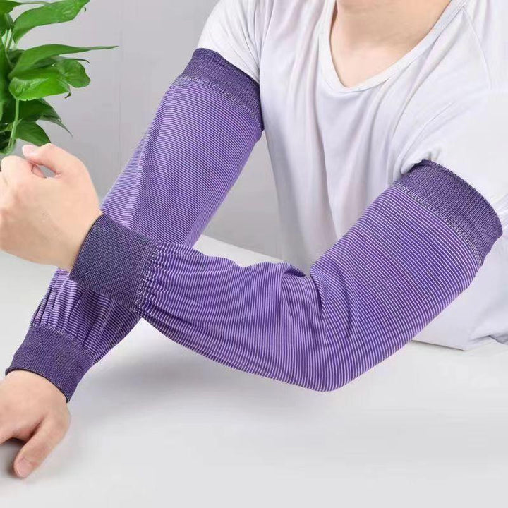 Person wearing purple striped compression arm sleeves over white short-sleeve shirt against white background