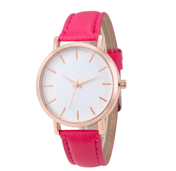 Minimalist rose gold watch with white dial and bright pink leather strap
