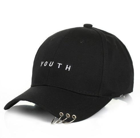 Black baseball cap with white YOUTH text and three silver metal rings on the brim