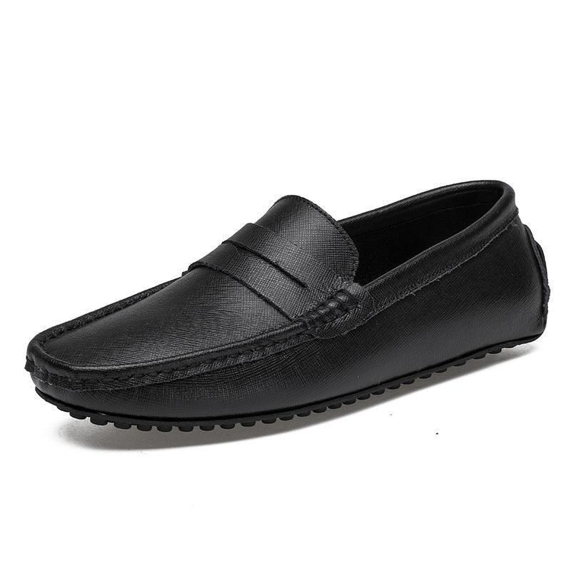 Black leather men's loafer with textured finish and rubber sole on white background