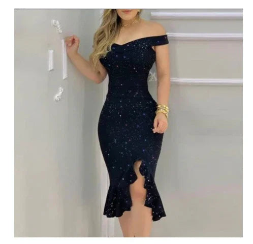 Woman wearing a black off-shoulder bodycon dress with ruffle hem standing indoors