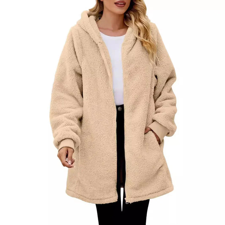 woman wearing beige fluffy sherpa fleece jacket with hood zip closure and pockets