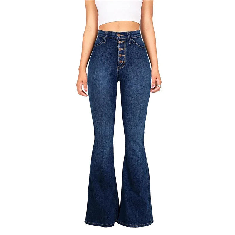 High-waisted dark blue flared jeans with button front worn by woman in white crop top