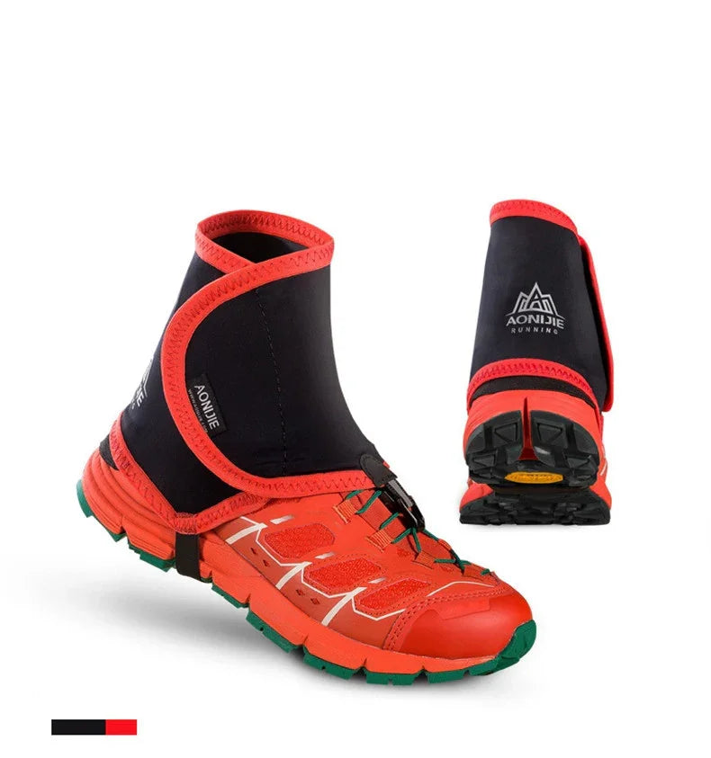 Red trail running shoes with black and red AONIJIE gaiters and green soles on white background