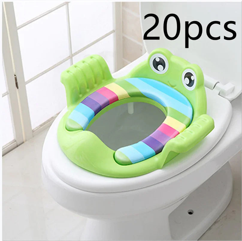 Green frog-themed colorful toddler potty training seat on white toilet bowl