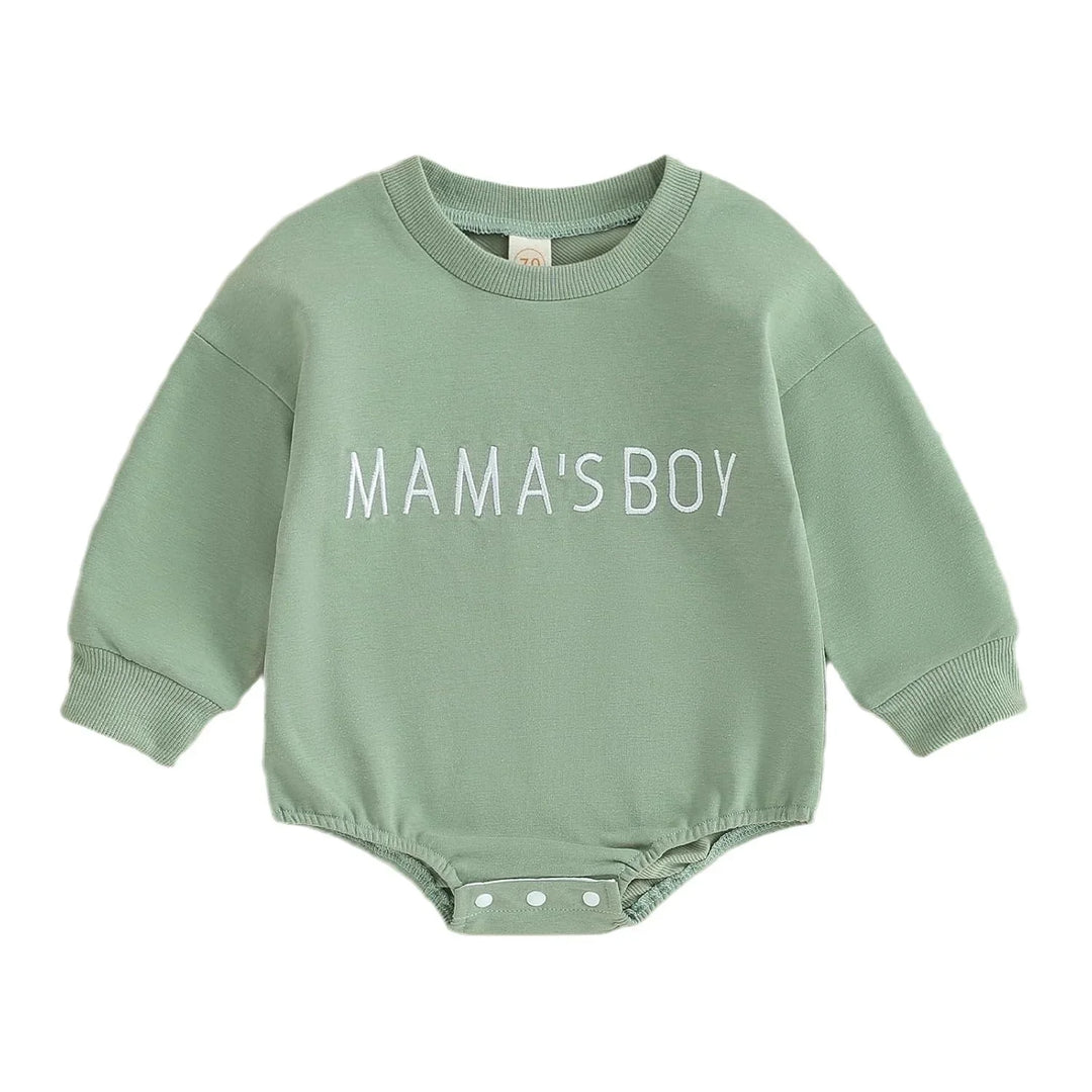 Green baby bodysuit with long sleeves and white text reading 'MAMA'S BOY', snap buttons at bottom