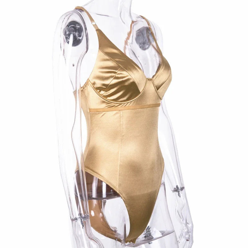 gold satin one-piece lingerie bodysuit on clear mannequin with adjustable straps