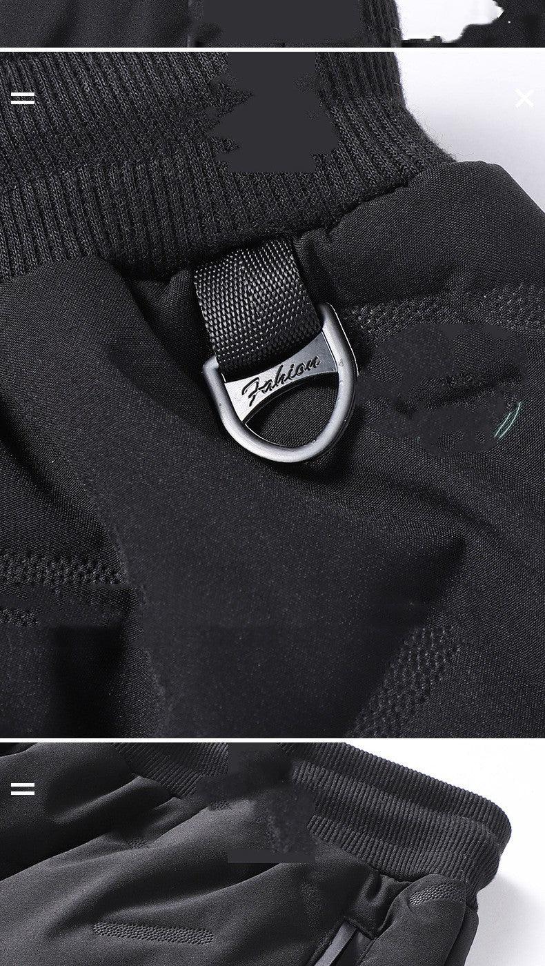 Black gloves with ribbed cuffs and metal D-ring detail labeled Fashion on durable fabric