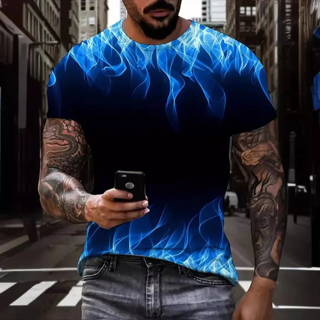 Man with tattooed arms wearing blue flame graphic t-shirt holding smartphone in urban street