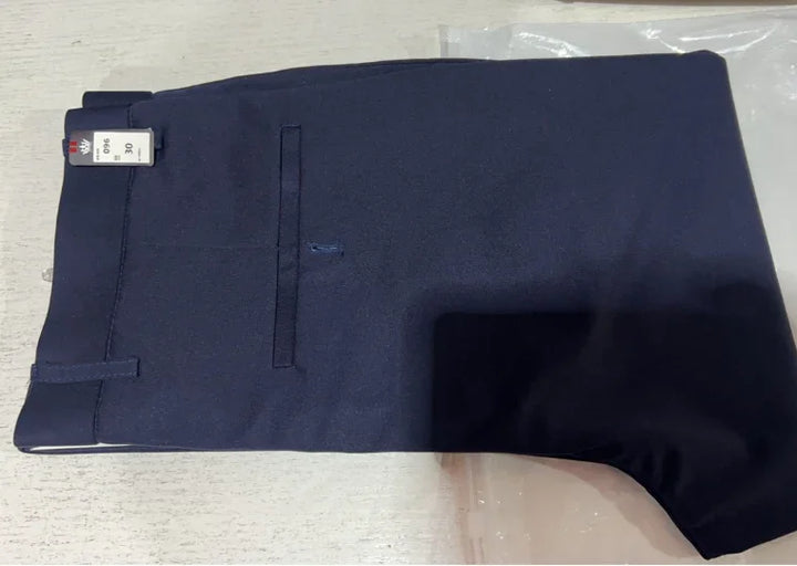 Folded navy blue formal trousers with back pocket and size tag on light surface