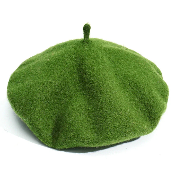 Green woolen beret hat with classic design and top stem detail on white background