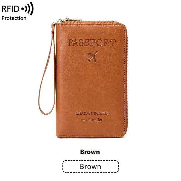 Brown leather RFID travel wallet with embossed passport text and wrist strap
