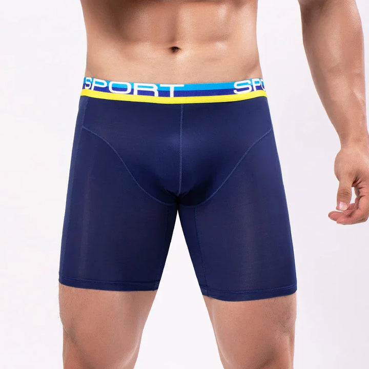 Muscular man wearing navy blue sport compression shorts with yellow and blue waistband