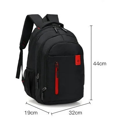Black backpack with red zippers and accents, multiple compartments, padded straps, dimensions 44x32x19 cm