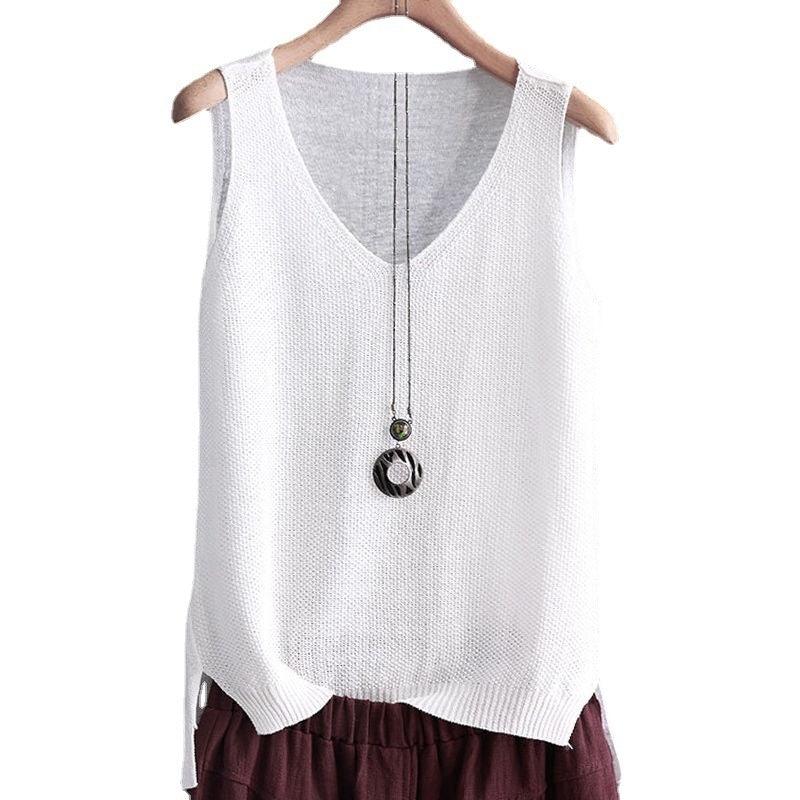 White knitted sleeveless top with V-neck on wooden hanger, paired with maroon pants and layered pendant necklace