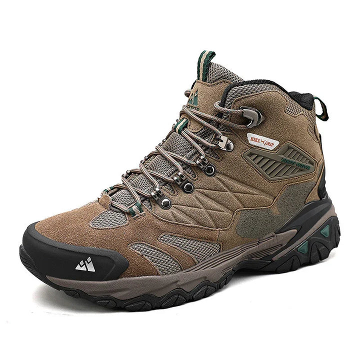 Brown and gray breathable hiking boot with durable sole and secure lacing system on white background