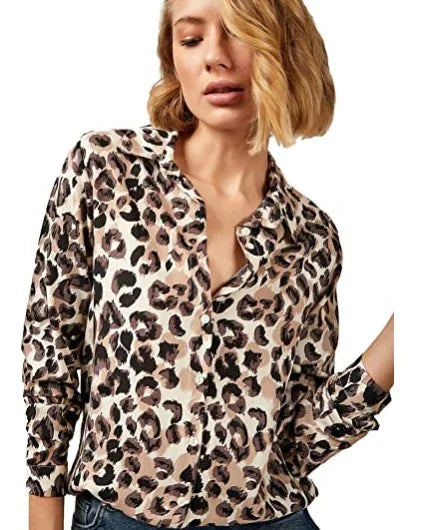 woman wearing leopard print long-sleeve blouse with buttoned front in casual pose
