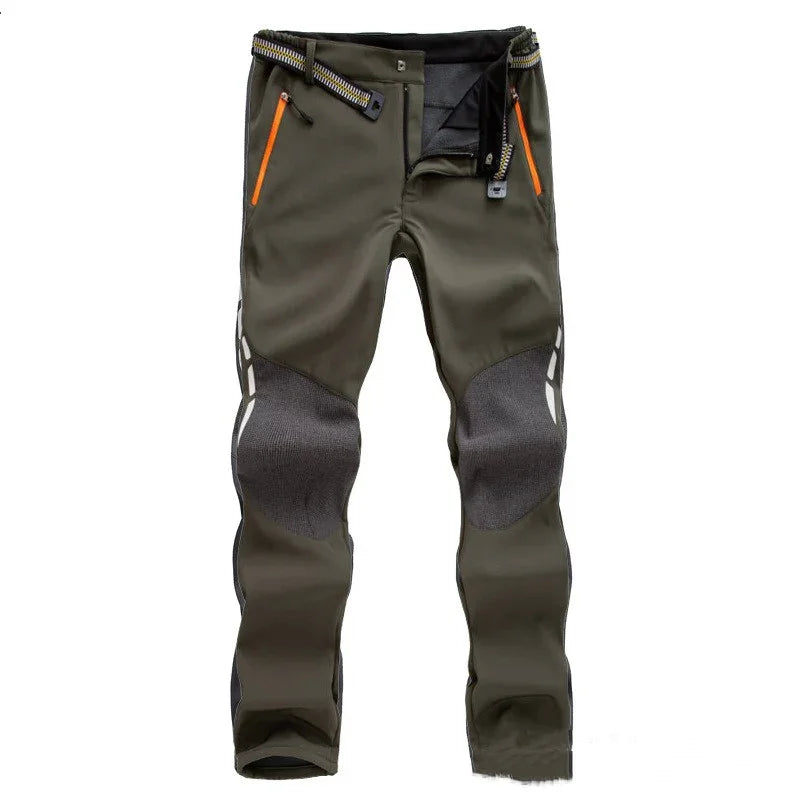 Men's olive green hiking pants with reinforced gray knee patches and orange zip pockets