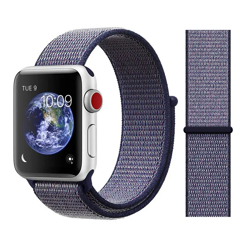 Silver Apple Watch with dark blue woven nylon sport loop band displaying Earth on screen and time 10:09