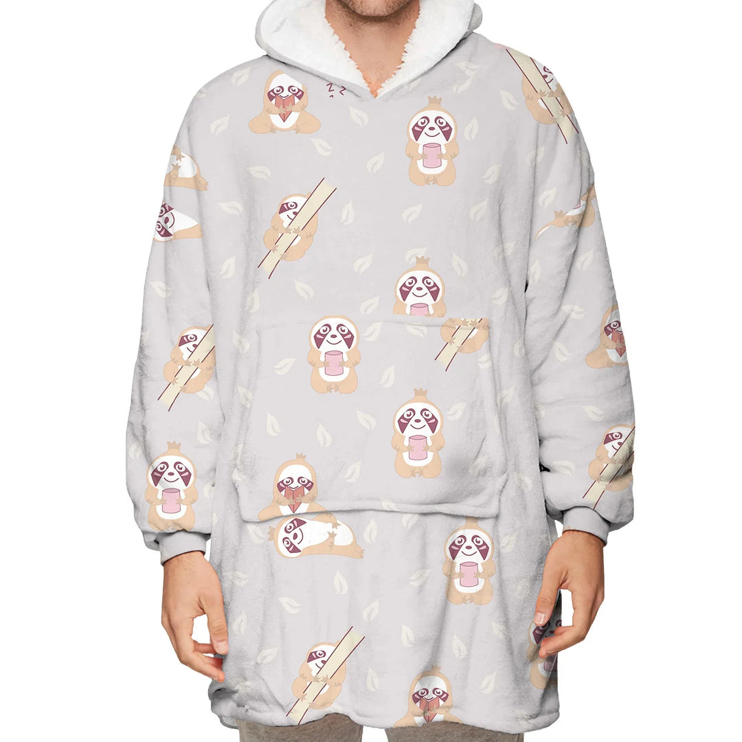 Cozy gray fleece hoodie with cartoon sloth and leaf pattern, worn by a person