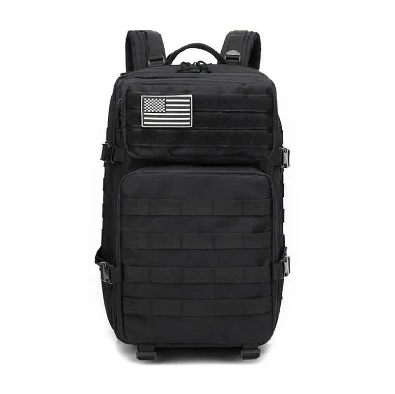Black tactical backpack with molle webbing and American flag patch on top front pocket