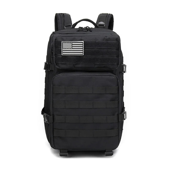Black tactical backpack with molle webbing and American flag patch on top front pocket