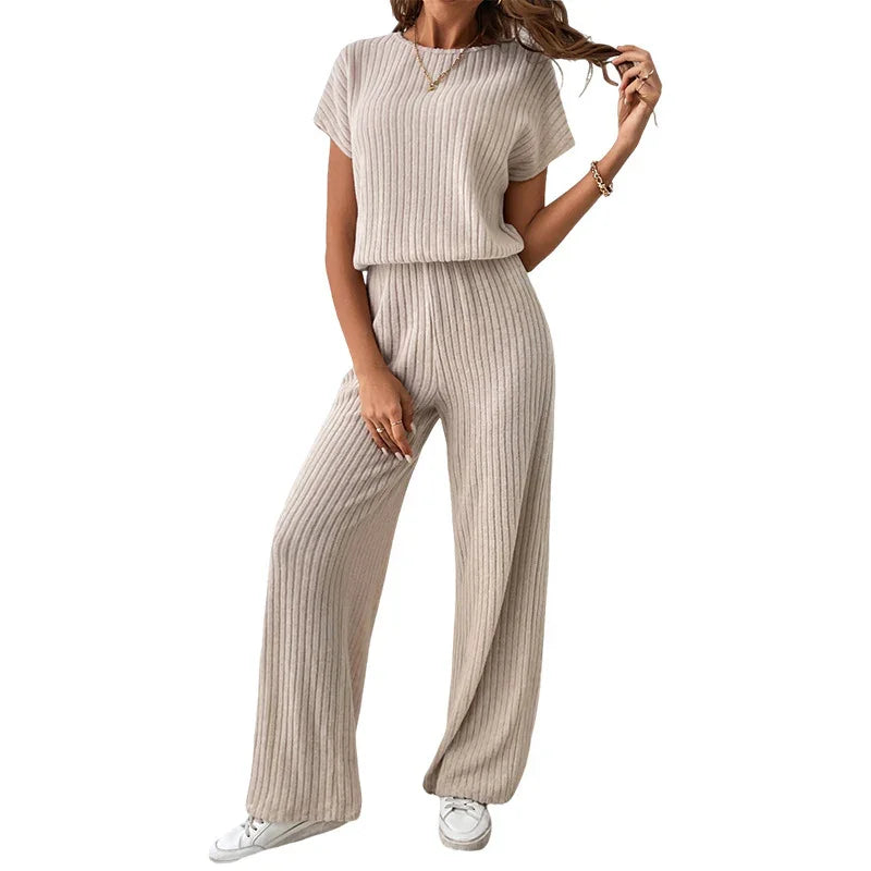 Woman wearing beige ribbed knit wide-leg pants and short-sleeve top with white sneakers