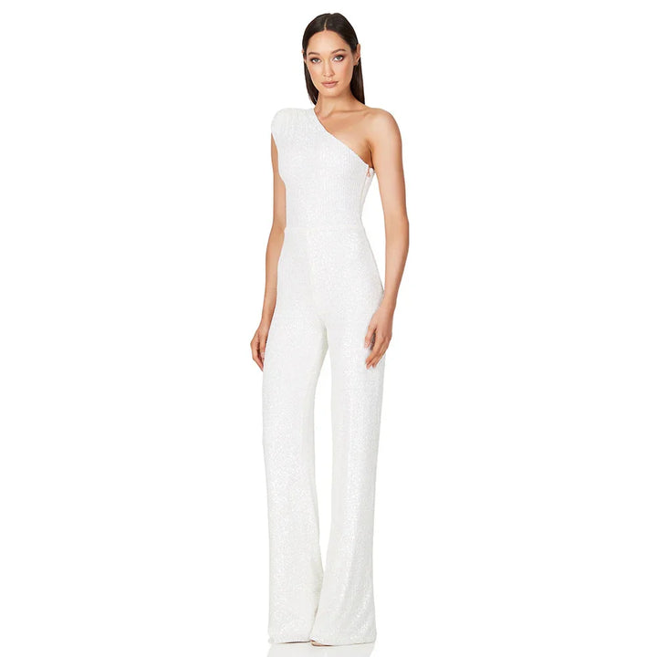 Woman wearing a white one-shoulder sequin jumpsuit with wide-leg pants on a white background