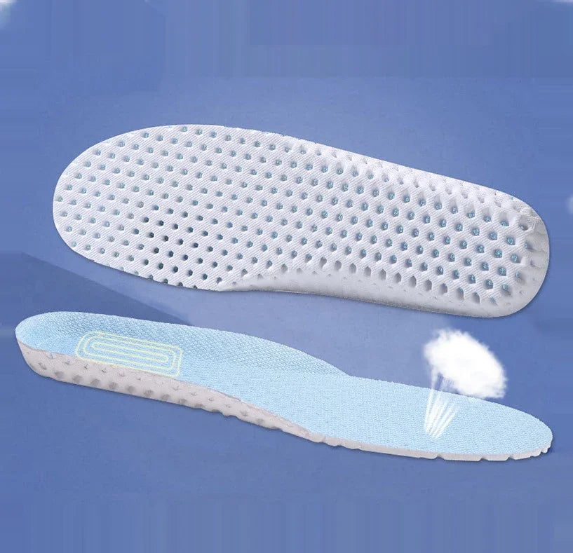 Breathable white and blue shoe insoles with perforated design on blue background