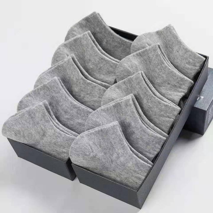 Set of multiple pairs of gray ankle socks neatly arranged in black gift box