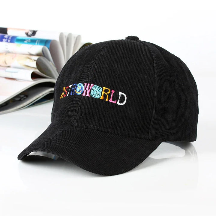 Black corduroy baseball cap with colorful embroidered ASTROWORLD logo on front