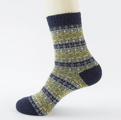 Knitted sock displayed on mannequin foot with navy blue, yellow, and gray patterned stripes
