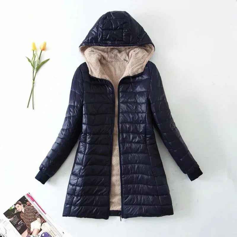 Navy blue quilted hooded winter coat with beige fleece lining, long sleeves, and zipper front
