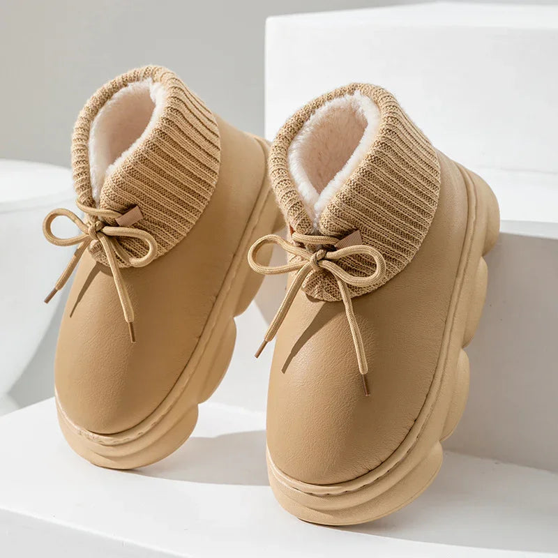 Beige winter boots with thick knit cuffs and fluffy white interior lining on white steps