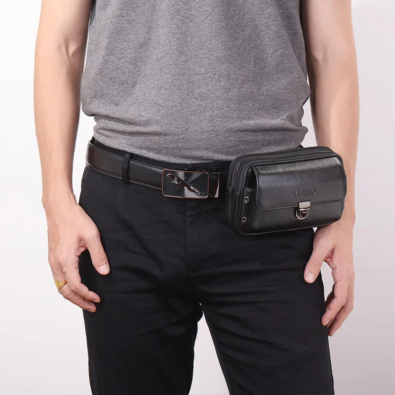Man wearing black leather belt with attached black leather waist bag and gray t-shirt