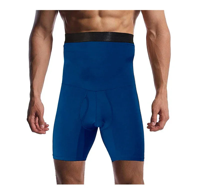 Male model wearing high-waisted blue compression shorts with black waistband on white background