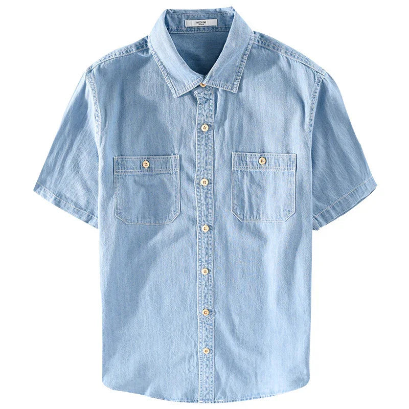 Light blue denim short-sleeve shirt with collar, front buttons, and two chest pockets