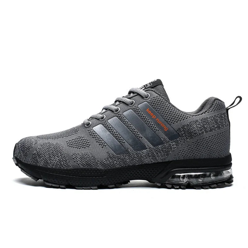 Gray knit running shoe with black sole, transparent air cushion, and orange "keep running" text