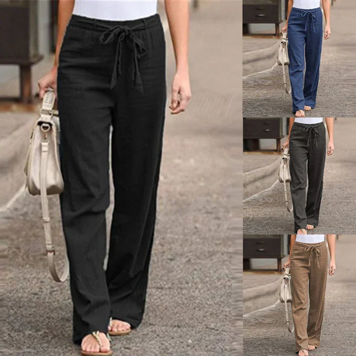 Women wearing casual drawstring pants in black, blue, gray, and brown, paired with white tops and beige handbags
