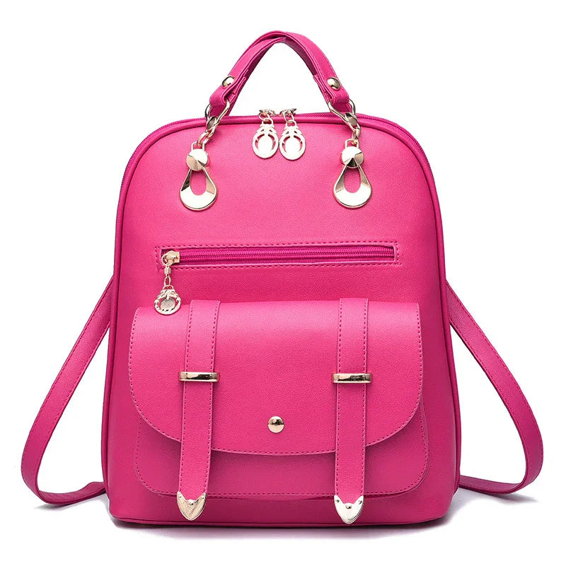 Bright pink women's backpack with front pocket, gold-tone hardware, and adjustable straps